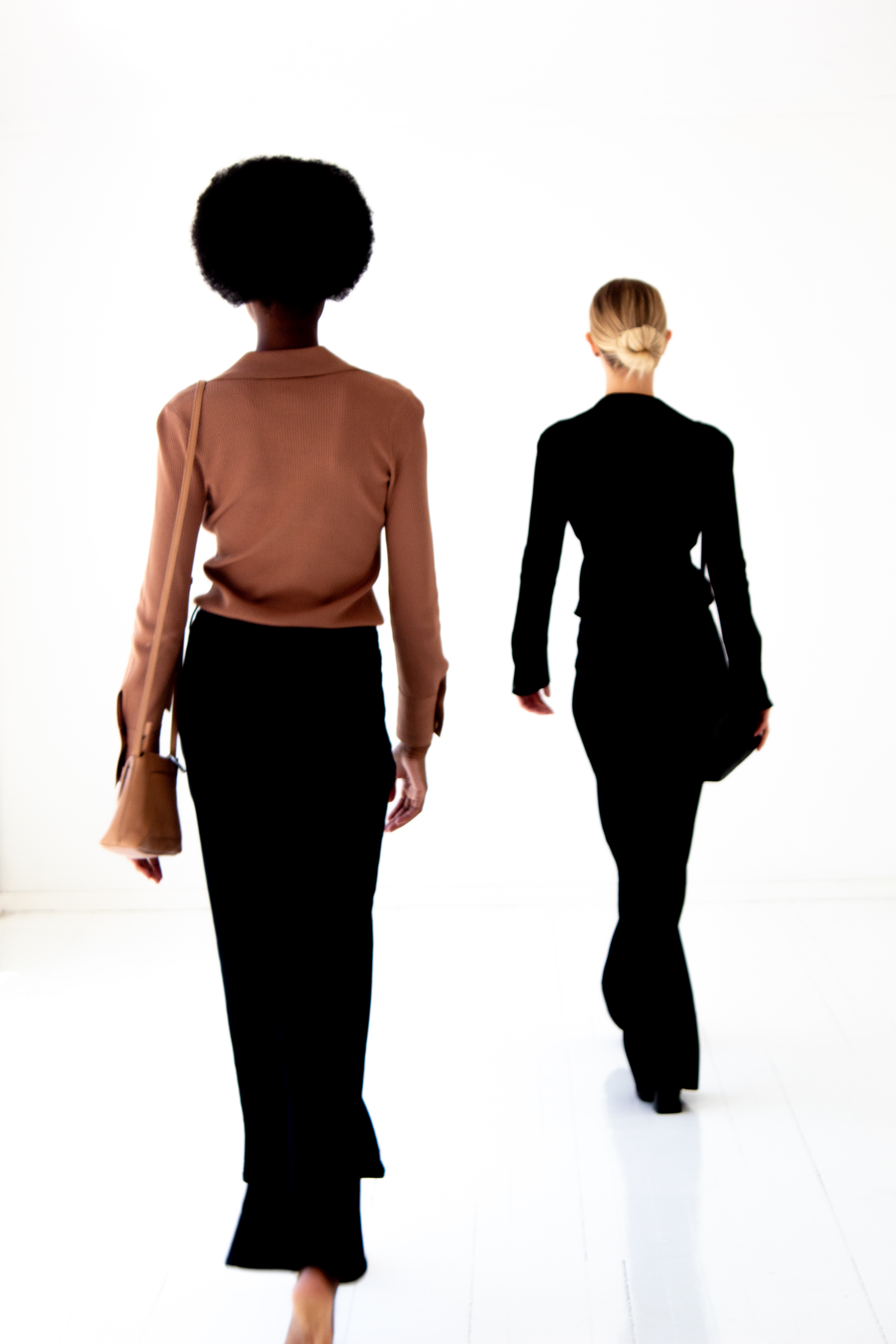 South African fashion — two figures walking, minimal studio editorial